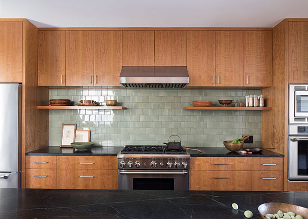 A consistent vocabulary of cherry casework is used throughout the house, including the kitchen. 