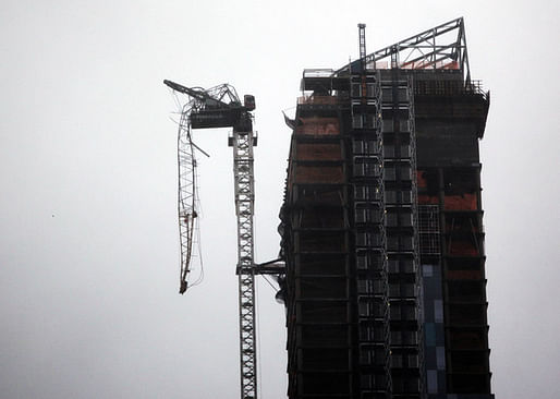 A crane attached to One57 is seen partially collapsed at 157 W. 57th St. in New York. (Photographer: Allison Joyce/Getty Images)