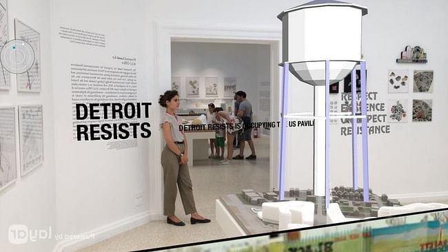 'The Architectural Imagination' pavilion overlayed by Detroit Resists's 'occupation'. Image via michiganradio.org.
