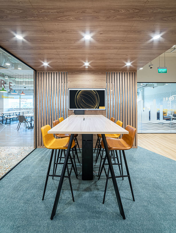 Office interior of Azqore with informal high table and chairs to serve as casual meeting space - designed by Space Matrix