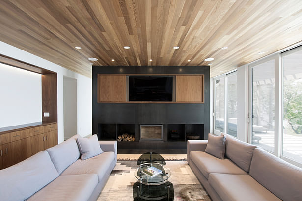 Living Space with Cedar Ceiling and Black Steel Fireplace