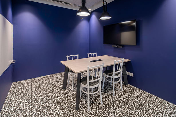 Peranakan-inspired meeting room at OMD with patterned tiles and kopitiam chairs - best workplace design for retro lovers