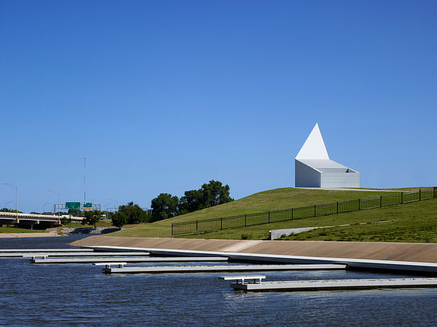 The Kayak Building seen from the north with docks in the foreground and I-35 in the background.