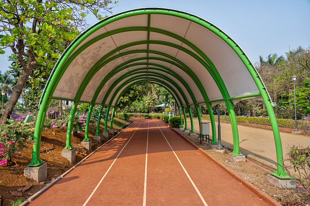 Circular tensile roof over a part of the jogging track.