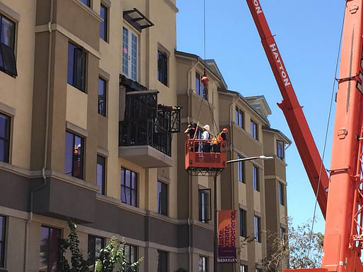 Crews examine a balcony that collapsed and killed and injured several people in Berkeley, Calif. on June 16, 2015. KGO-TV/Elissa Harrington