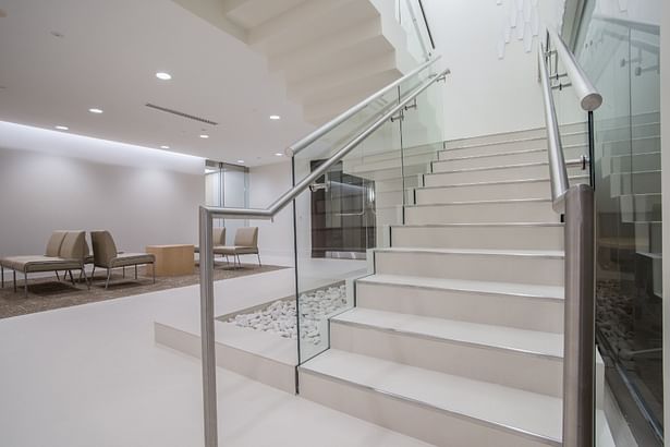 Bottom of staircase with extension required for commercial handrails
