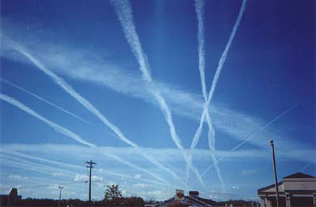 Contrails or chemtrails? Conspiracy theorists believe the government is dumping dangerous chemicals into the atmosphere. Via Wikipedia