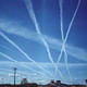 Contrails or chemtrails? Conspiracy theorists believe the government is dumping dangerous chemicals into the atmosphere. Via Wikipedia