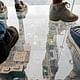 Participants stand on the new glass balconies suspended 1,353 feet in the air and jut out 4 feet from the Willis Tower's 103rd floor Skydeck on July 1, 2009 in Chicago. (Mashable; Image: Kiichiro Sato/Associated Press)