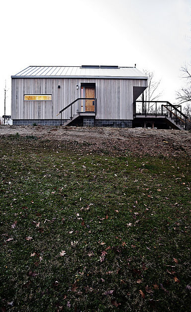 east elevation - the house uses fenestration to better frame the landscape and to make connections between interior and exterior (photo credit ken mccown)