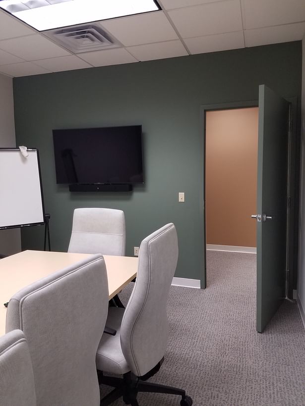 Small conference room newly painted with Benjamin Moore's 'Lush'.