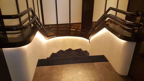 Continuous curved wooden handrail in a restaurant in New York, USA 