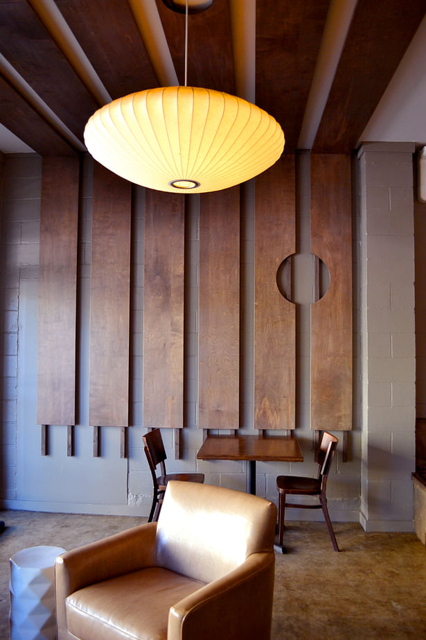 New wood paneling folds over the walls and ceiling