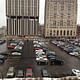 Current situation of Flint's central downtown parking lot: Mott Foundation building is on the right; Genesee Towers, on the left, is slated for demolition (Image courtesy of Flat Lot Competition)