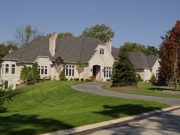 The expansive exterior is complemented by natural stone.