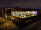 Night view of 'Overlook' lounge/event space atop the distillery. Photo by Steve Grider.