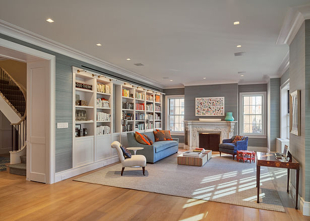 Beautiful soft tones accentuated by pops of color and an ornate fireplace create a cozy, yet elegant living space.