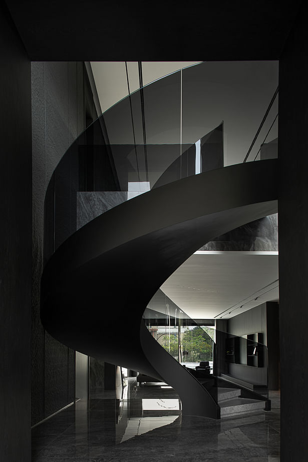 A curved staircase shaped like a sculpture