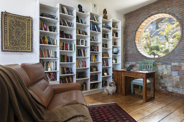 The southern window in the study area, provides warm sunlight while reading. The study table is kept minimal deliberately since recliner is mostly ulilised by the clients for reading.