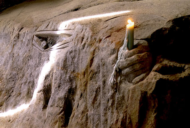 Six-finger troll welcoming visitors with a candlelight