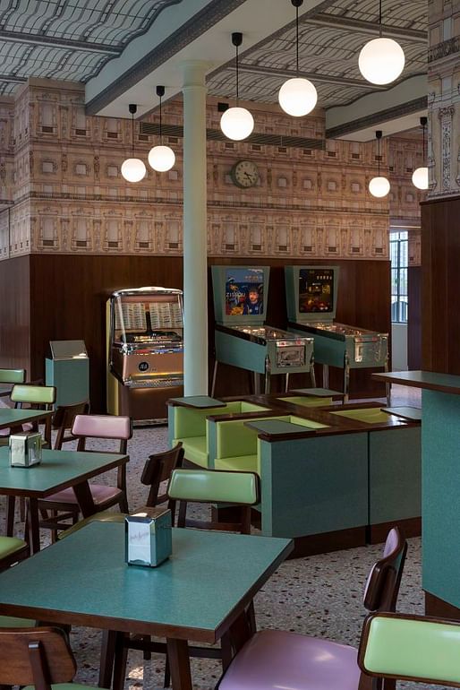 Wes Anderson's Bar Luce, which opens May 9 at the Prada Foundation Arts Complex in Milan, takes inspiration from a “typical” 1950 Milanese café. Yes, including a Steve Zissou pinball machine. (Photo: Fondazione Prada; Image via qz.com)