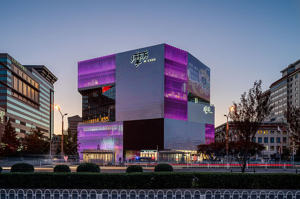 The surface treatment of the façade also breaks up the mass of the building while responding to the light and view requirements of the interior program. While some areas of the surface were required to have blind facades to accommodate the stores behind, other stores are able to use diffuse light to their advantage, and here the ceramic tiles are used in a checkerboard pattern. In other places such as lobbies and cafes, fully glazed facades provide a visual connection between the inside of...