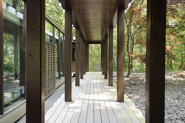 In the original layout, a covered walkway lead to the primary entrance. The walkway, passing through Domoto's revived rock garden, was preserved and still leads to a formal entry - an informal family entry was added off the new carport to the addition, which includes a mudroom.