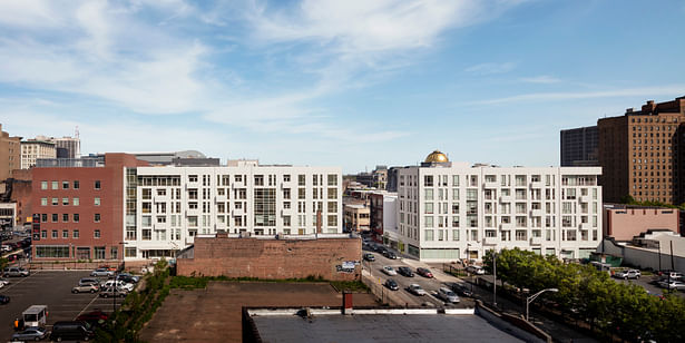 View of Residential Building VI and VII from Washington Street. Image by Scott Frances.