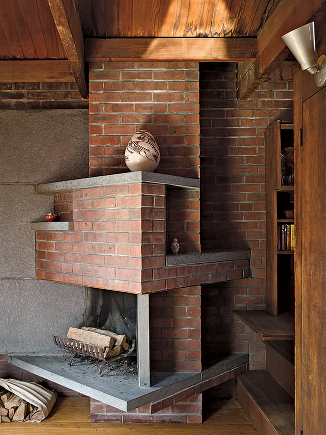 The third-floor sitting room’s angular brick fireplace. Annie Schlechter