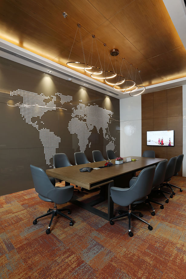 Conference Room: State of the art conference room with a world map done in lacquered glass as a feature wall, to depict the company’s presence across the globe. 