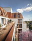 In the apartments, the large bay windows and balconies create visual connections between the street, the homes and the beautiful trees that line the road. A sense of expanding the space is created by pushing the inside out and pulling the outside in. Text courtesy of UNStudio. Visualizations by...