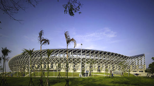 World Games Stadium, completed in 2009, features nearly 9,000 solar panels. (Christian Richters). Image via latimes.com.