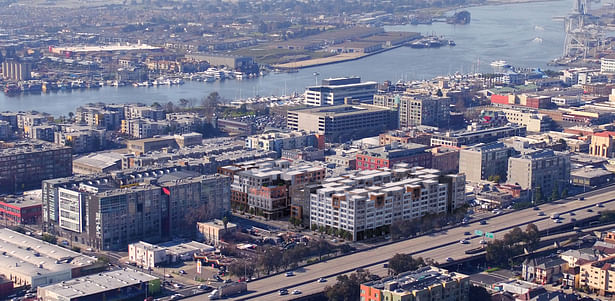 Aerial rendering shows how the project responds to its surrounding context in the Jack London Square District.