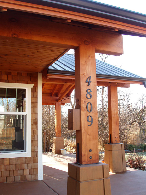 Heavy timber entry columns create a significant entry sequence.