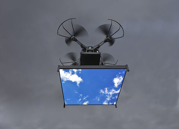 The drone flying with the digital video monitor and images of the sky.