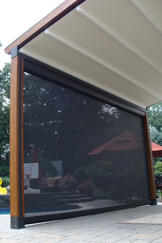 The Gennius Pergola Awning with cover projected, and solar shade dropped
