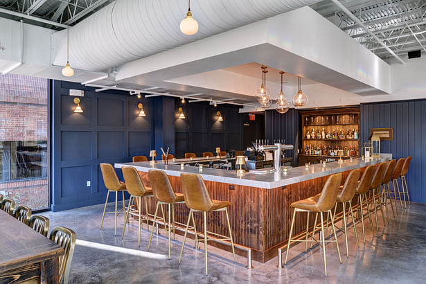 Bar highlighted with accent wall. Image courtesy JZA+D.
