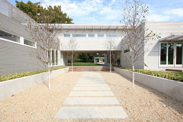 Entry Tree Court with Poured-In-Place Concrete Pavers and Retaining Walls