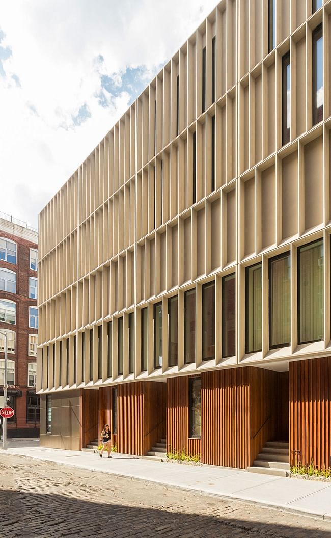 Photo of Alloy's DUMBO Townhouses, which is wrapped in a Ductal concrete panel facade. Image courtesy of Alloy Development