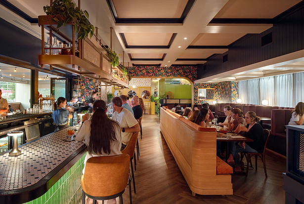 View of the primary dining room and bar, with the 'brunch room' in the background.