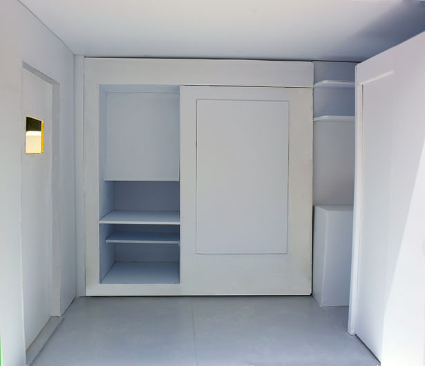 This is one of the pullouts that would contain a workspace, storage, and a closet. 