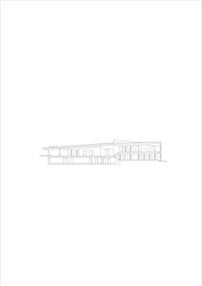 Longitudinal section. Image courtesy of Roeoesli & Maeder Architects.