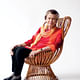 Jane Thompson sitting in a Franco Albini chair. Photograph by Jared Leeds, via Boston Magazine.
