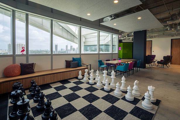 Collaboration area with giant chess set at PHD designed by corporate interior design firm Space Matrix