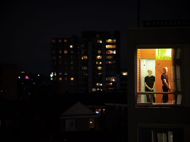 The Cabanon and its large window glow in the night sky of Rotterdam. Guido likes to watch the Willems bridge before closing the curtain and going to bed. ©Ossip van Duivenbode