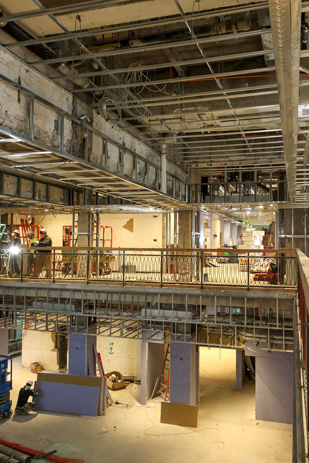 View of Dining Hall double height space with existing deep beams 