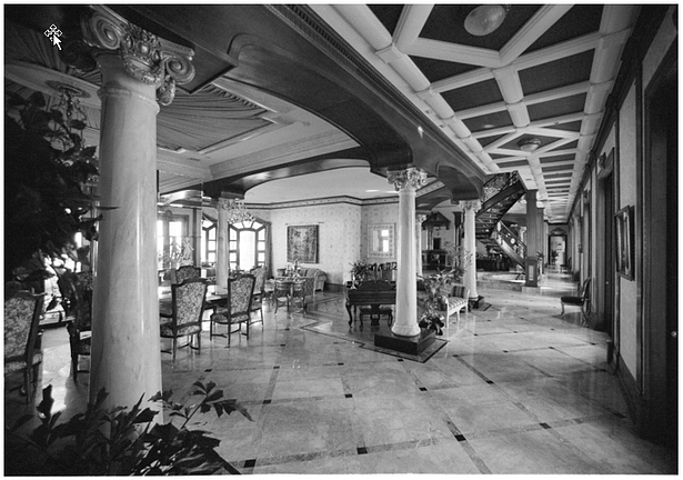 View of Gallery with Formal Dining at left