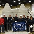 Members of the Penn State team pose in front of the first fully enclosed 3D-printed housing structure at NASA's 3D-Printed Mars Habitat Challenge in Peoria, Illinois. Credit: Penn State. Creative Commons
