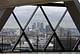 Seen here from the vacant sixteenth floor of 30 St Mary Axe, the large skyscrapers of Canary Wharf constituted a new business district to the east of the City. Photograph by author.