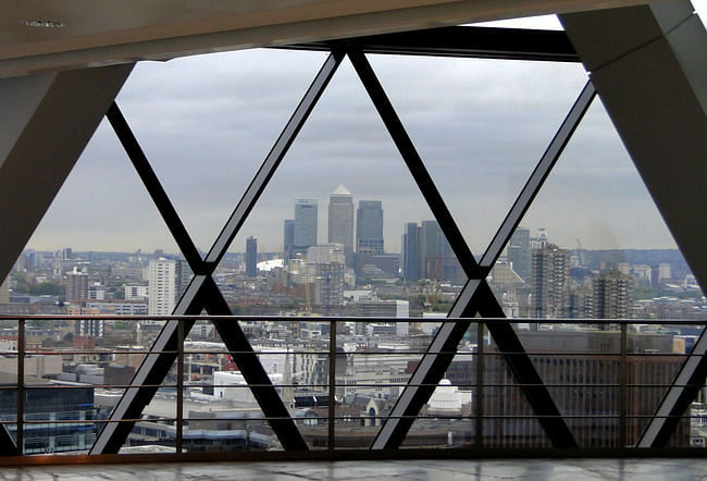 Seen here from the vacant sixteenth floor of 30 St Mary Axe, the large skyscrapers of Canary Wharf constituted a new business district to the east of the City. Photograph by author.